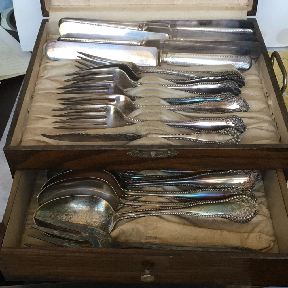 Vintage silverware set in original wooden chest with certificate of authenticity